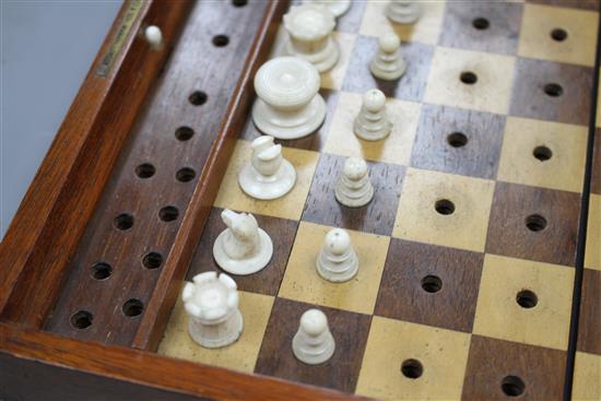 A late 19th century Jaques, London Travelling In Statu Quo travelling chess set, the original leather case containing a boxwood